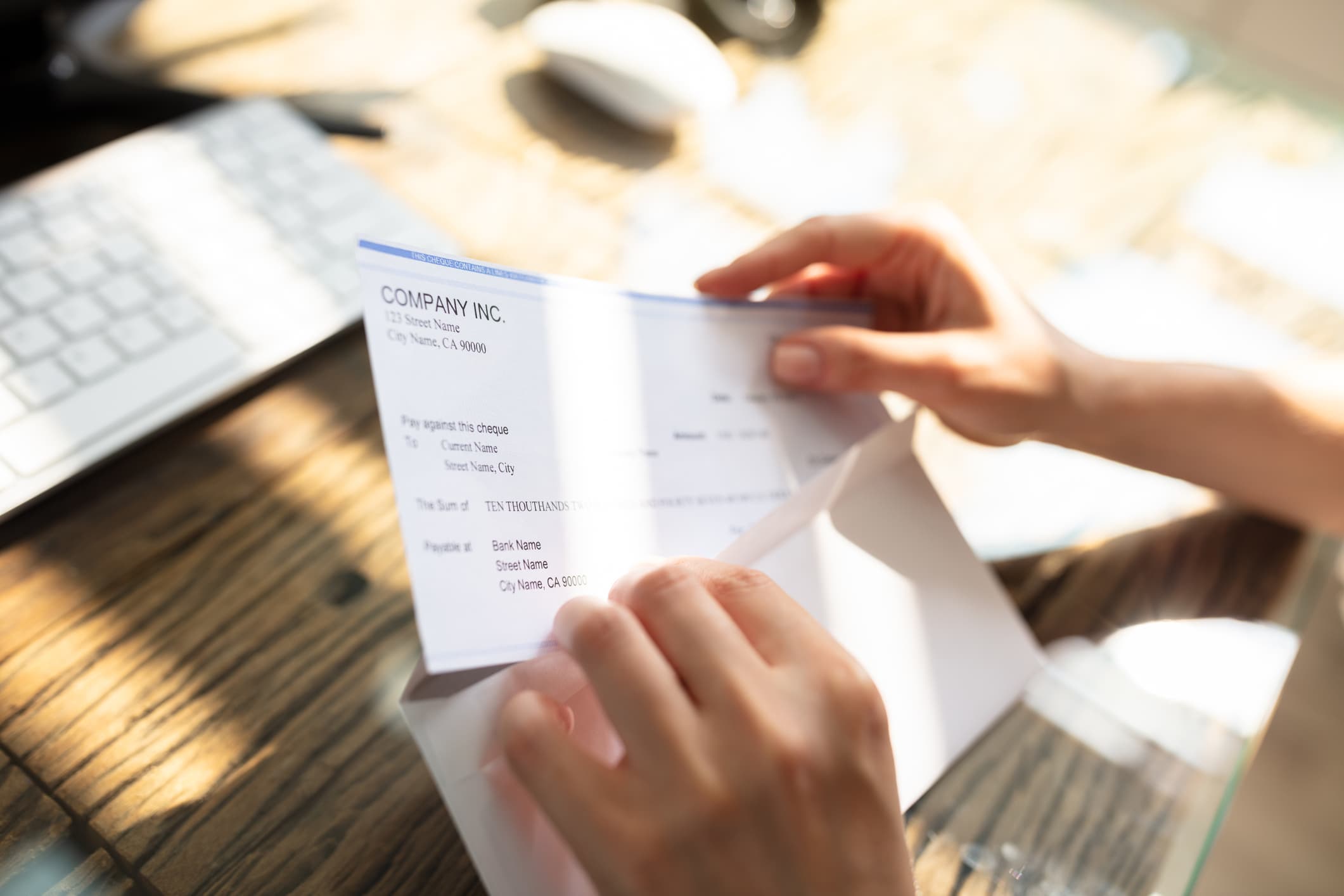 person opening a paycheck